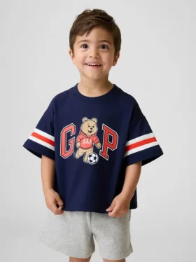 Μπλουζάκι με γραφικά και λογότυπο Brannan Bear Varsity σε oversized γραμμή για Βρέφη & Νήπια