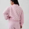 Παιδικό μπουφάν με φερμουάρ, καπιτονέ και oversized γραμμή